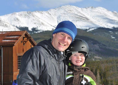 Kevin skiing with his son Henry